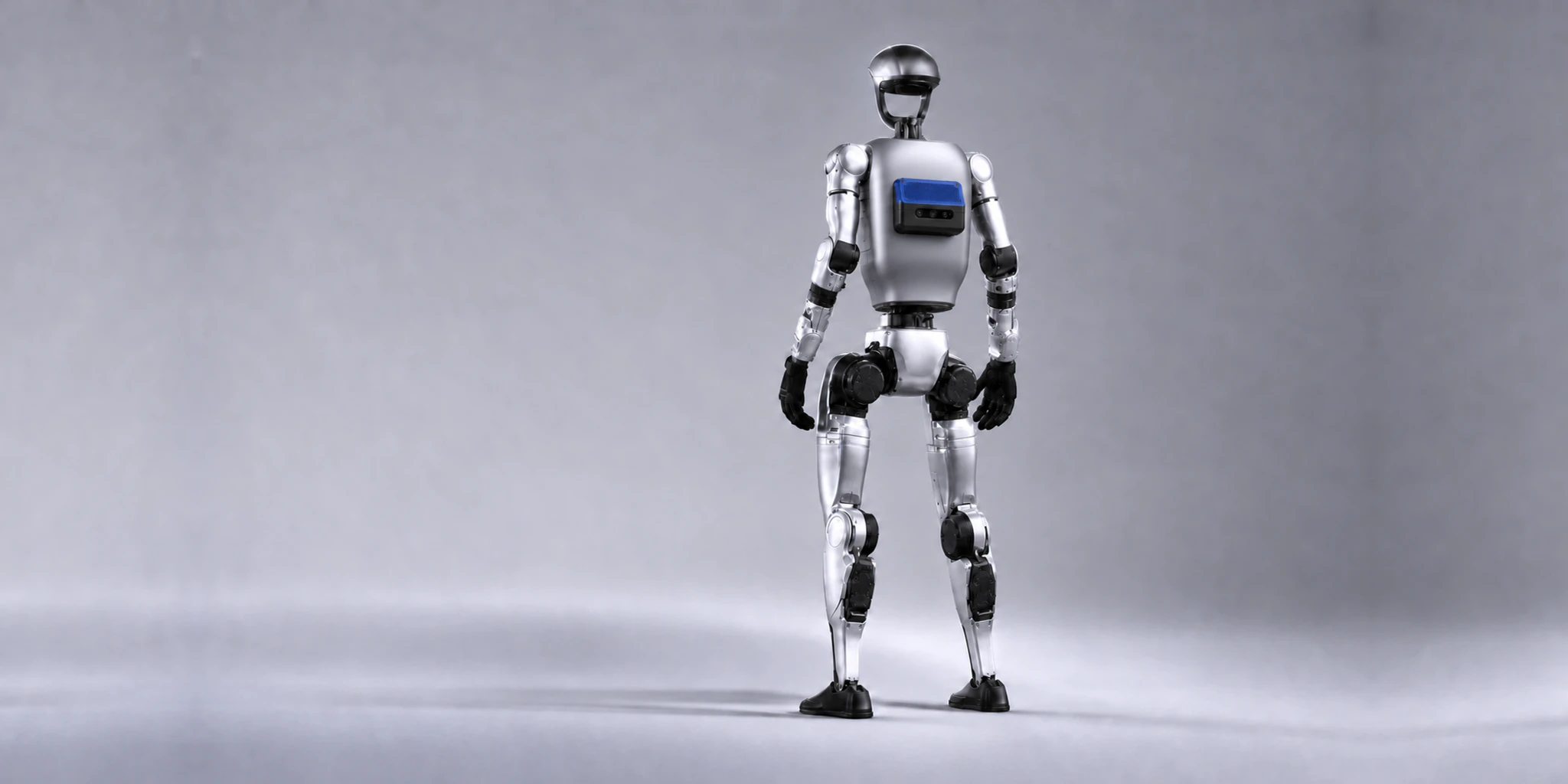 Humanoid robot viewed from behind with Kinematics Max mounted as its edge computer